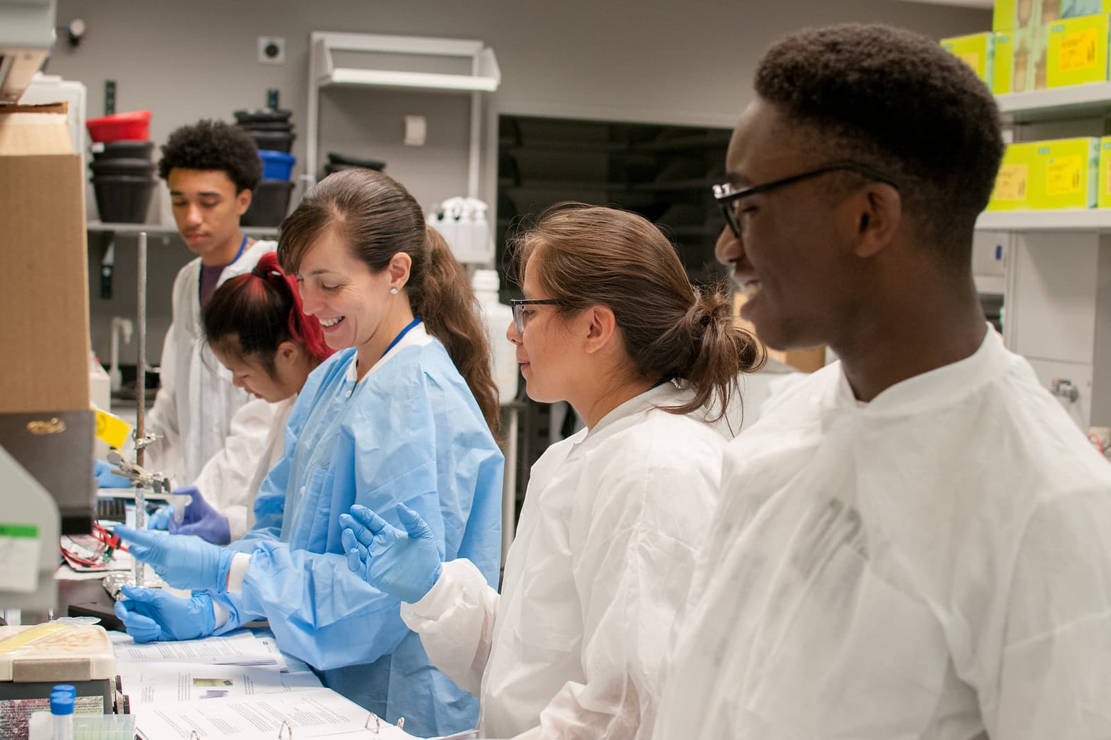 Research team training at a laboratory bench