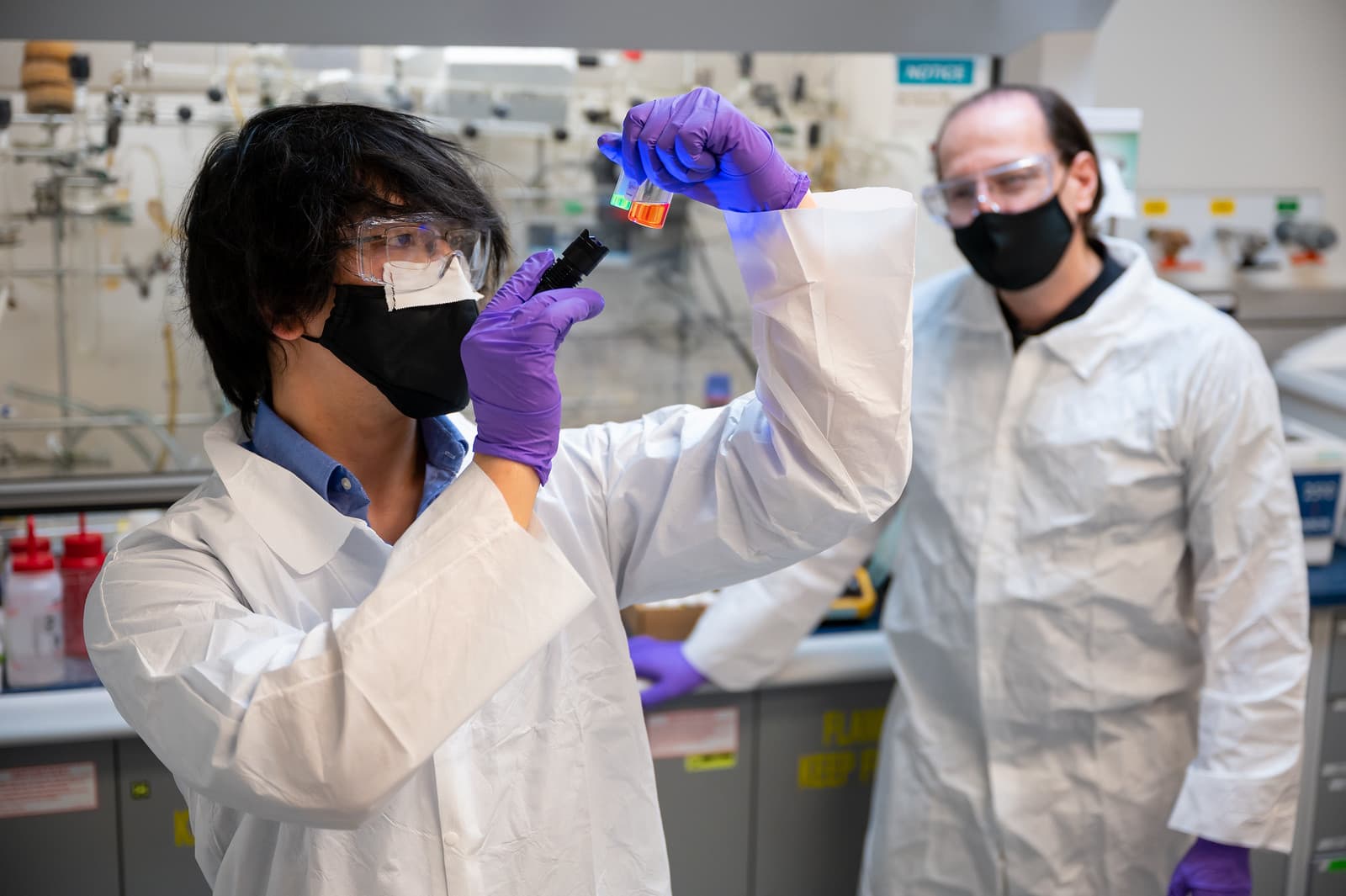 Researchers examining a sample in a well-equipped laboratory