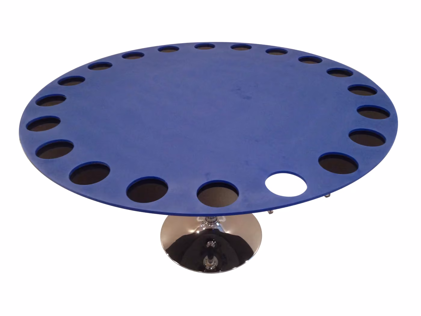 A blue Barnes maze: a round table on a chrome stand with escape holes around its edge