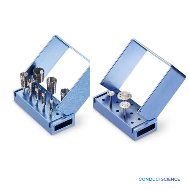 Cranial trephines and circular saws for microdrill workflows arranged in blue storage blocks with ConductScience watermark