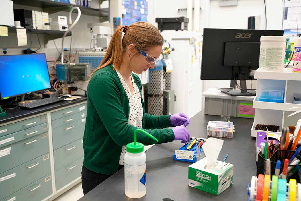 NIST researcher carefully preparing samples at a lab bench