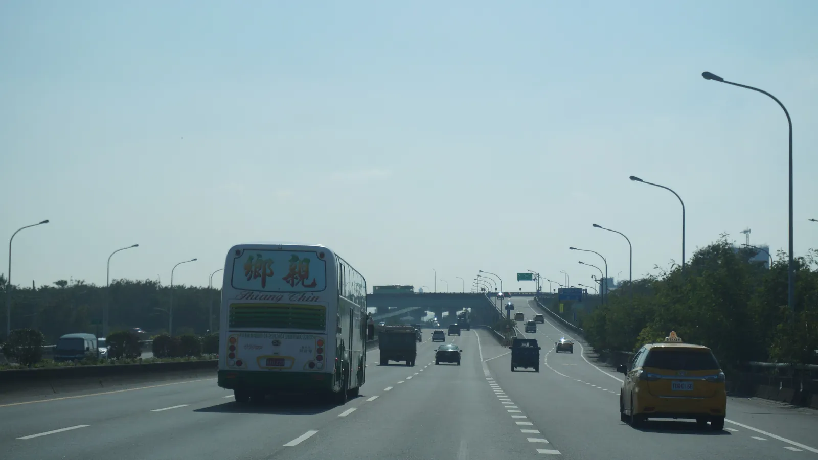 Traffic on Highway 74 near the Taichung high speed rail interchange in Taiwan; boxes mark a coach, 10 cars and a truck.