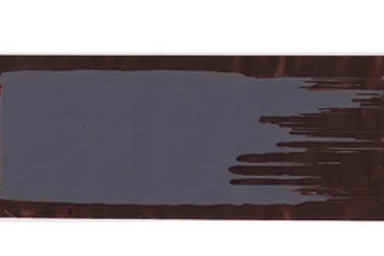 Coated lithium-ion battery electrode on foil showing a ragged, chattered uncoated edge defect