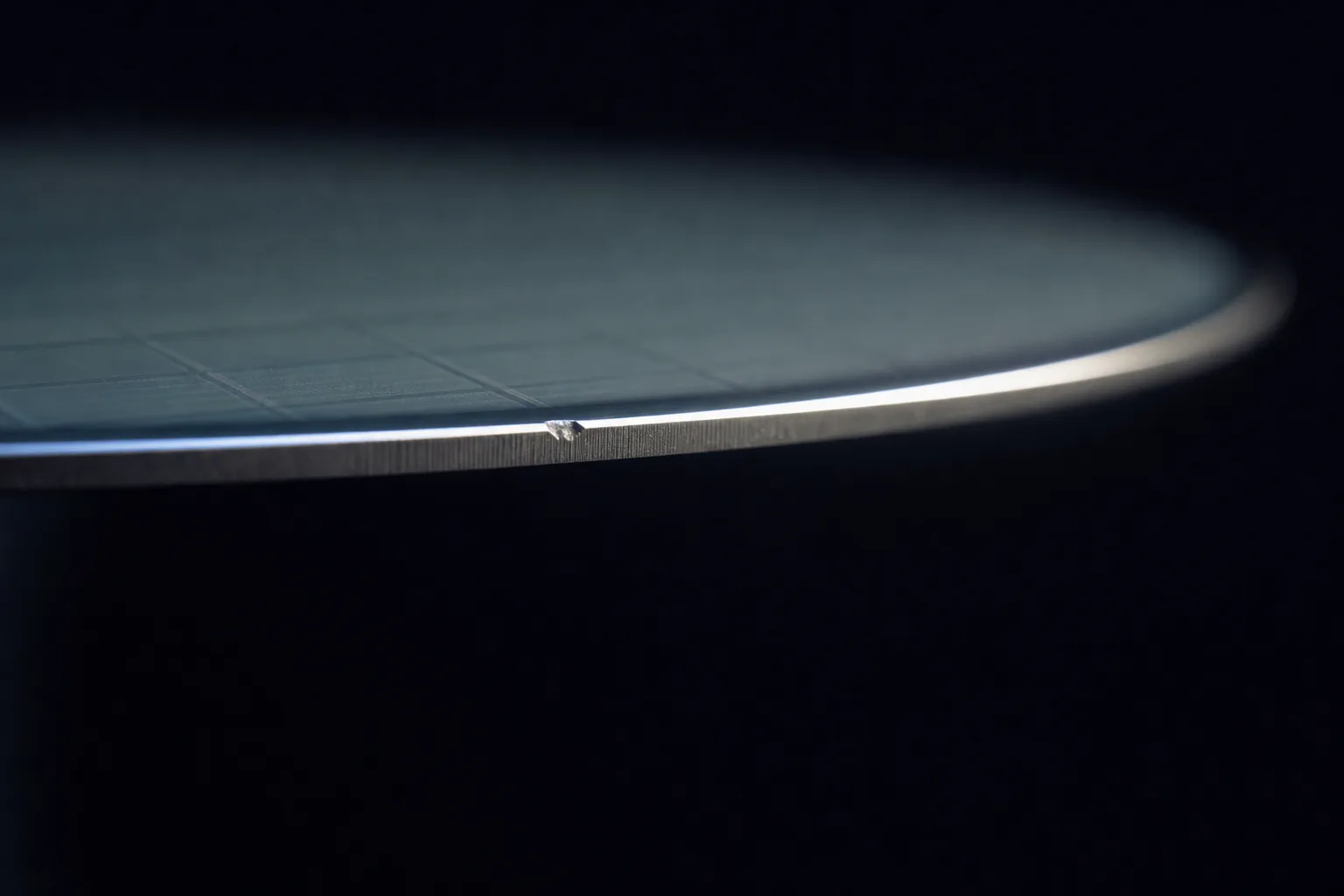 Illustrative side view of a silicon wafer edge with a small chip for edge and geometry inspection