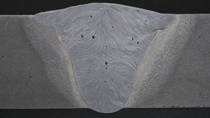 Etched weld cross-section with porosity for weld defect analysis