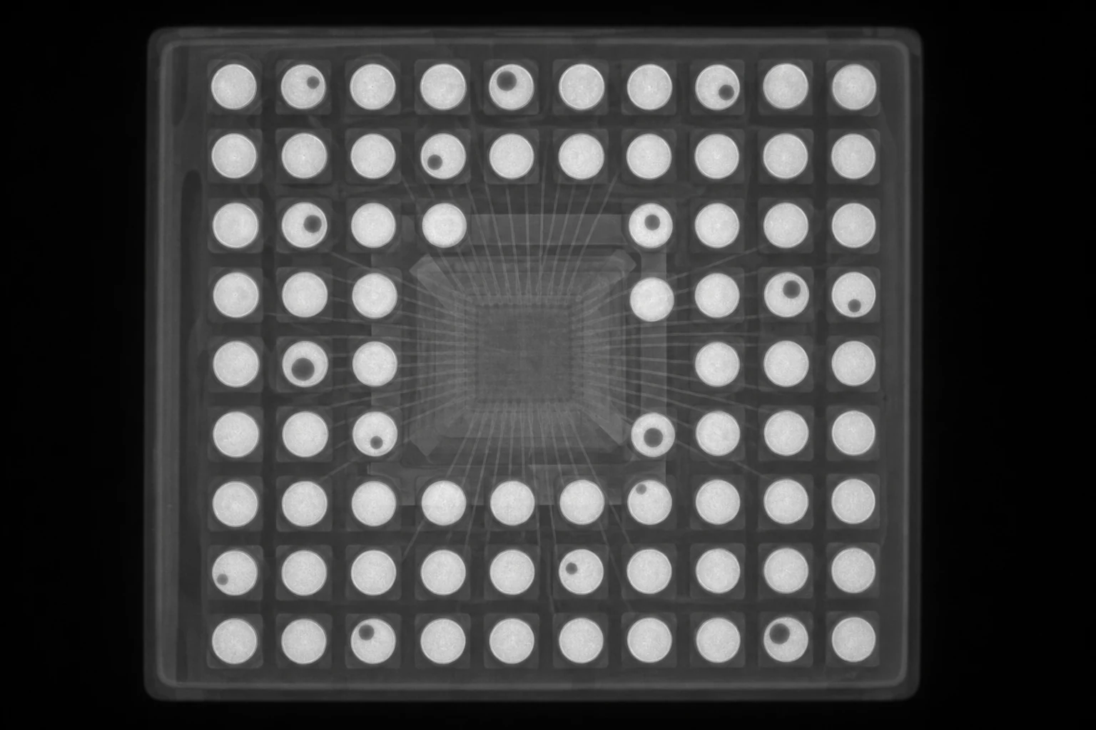 Illustrative X-ray view of a semiconductor package and BGA solder array with voids
