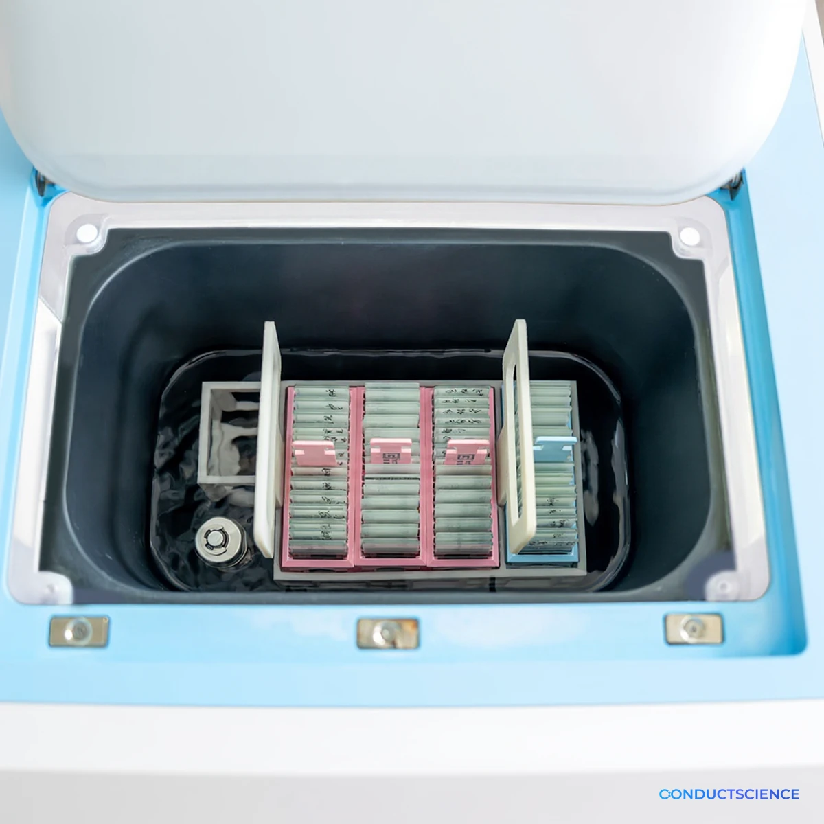 Inside the retrieval chamber: basket rack holding slide staining racks